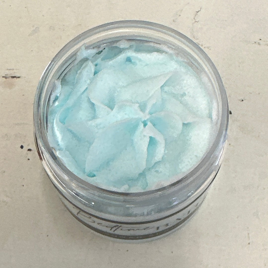 Doodlations Coffee Bar & Boutique Bedtime Bath Sugar Scrub, light blue whipped texture in a clear jar.