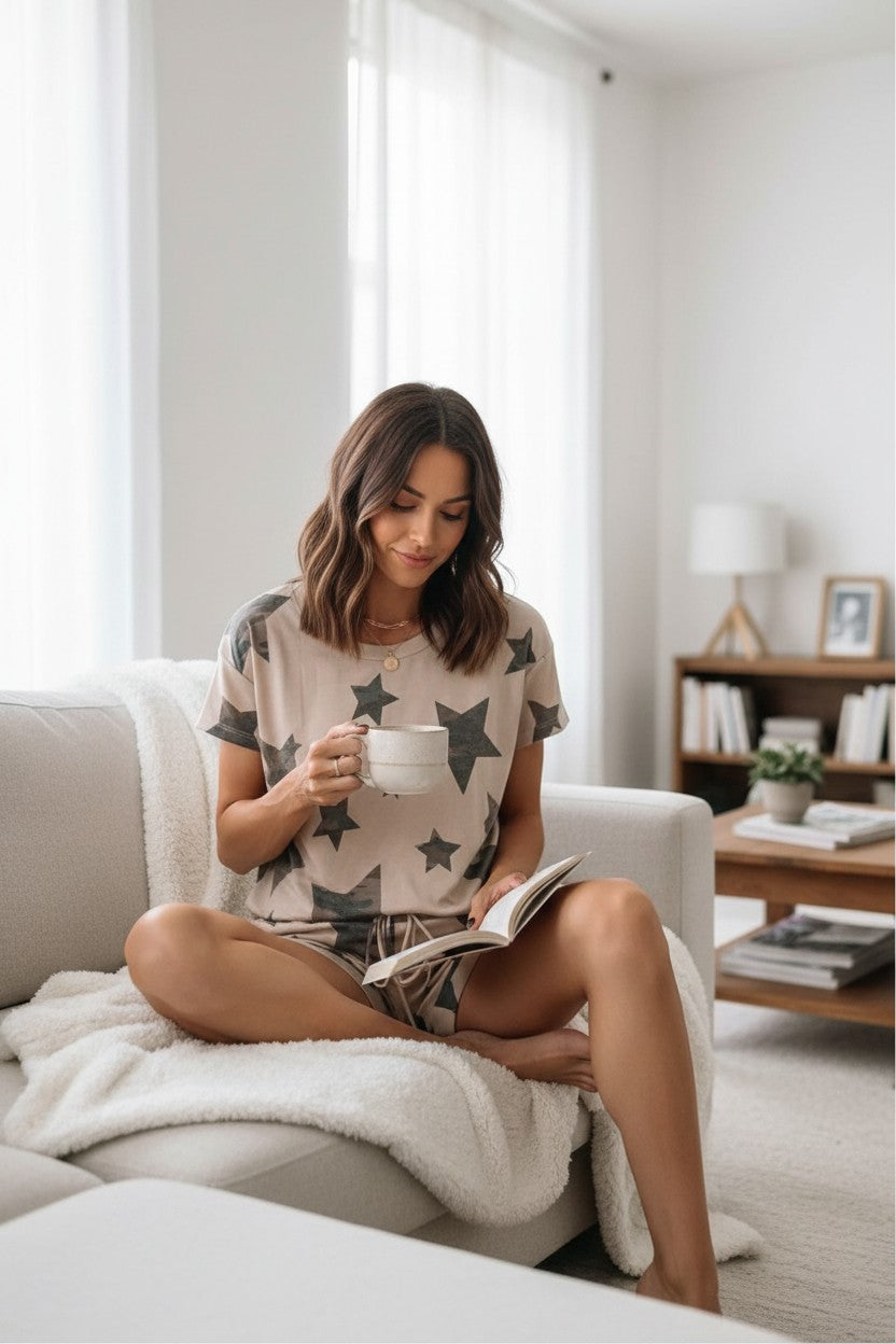 Doodlations Coffee Bar & Boutique beige lounge set with camouflage star print, featuring a relaxed-fit t-shirt and drawstring shorts.