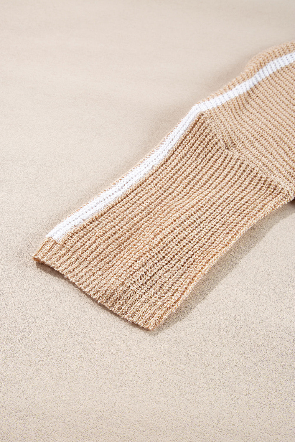Doodlations Coffee Bar & Boutique light beige knit sweater sleeve with white contrast stripe detail