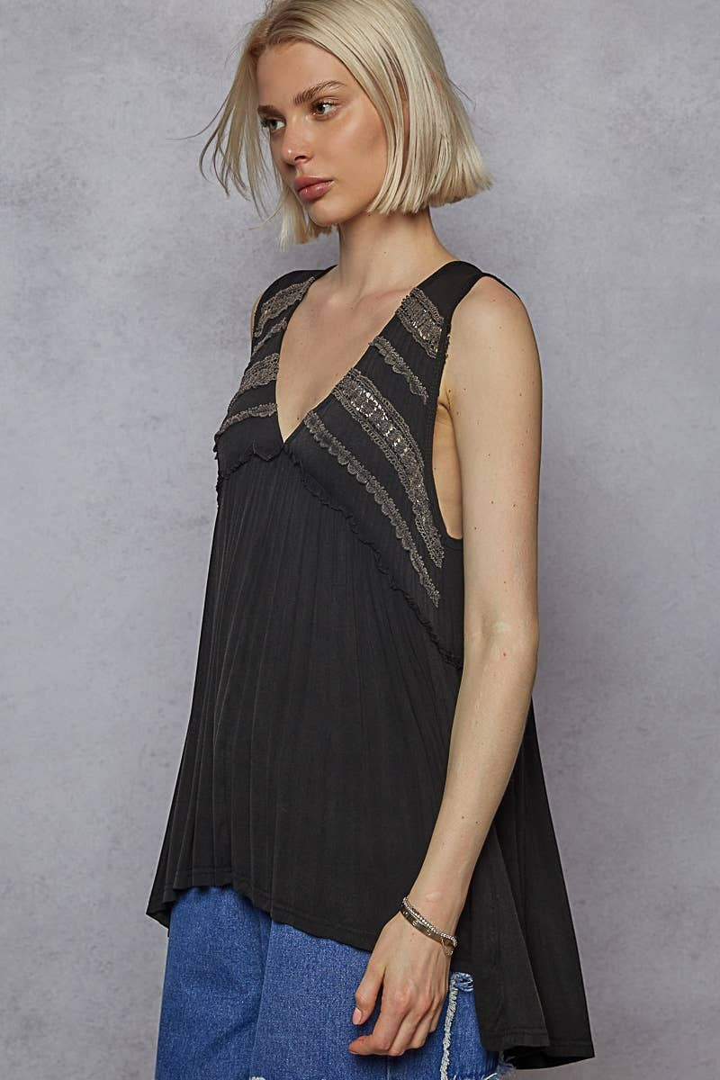 Doodlations Coffee Bar & Boutique black sleeveless babydoll top with lace trim, V-neck, and raw edge details.