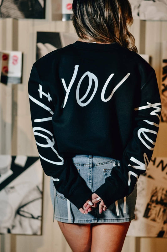 Doodlations Coffee Bar & Boutique black pullover sweatshirt with white script graphic on back and sleeves