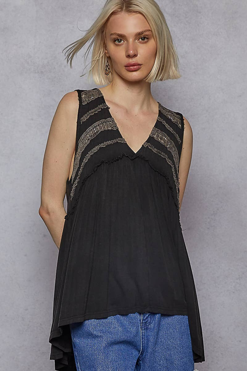 Doodlations Coffee Bar & Boutique black sleeveless babydoll knit top with lace trim, V-neck, and raw edge details.