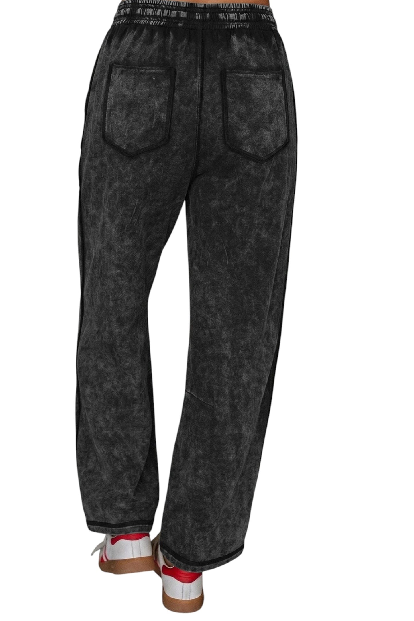 Doodlations Coffee Bar & Boutique black mineral wash barrel pants with raw seams, elastic waist, and back pockets.