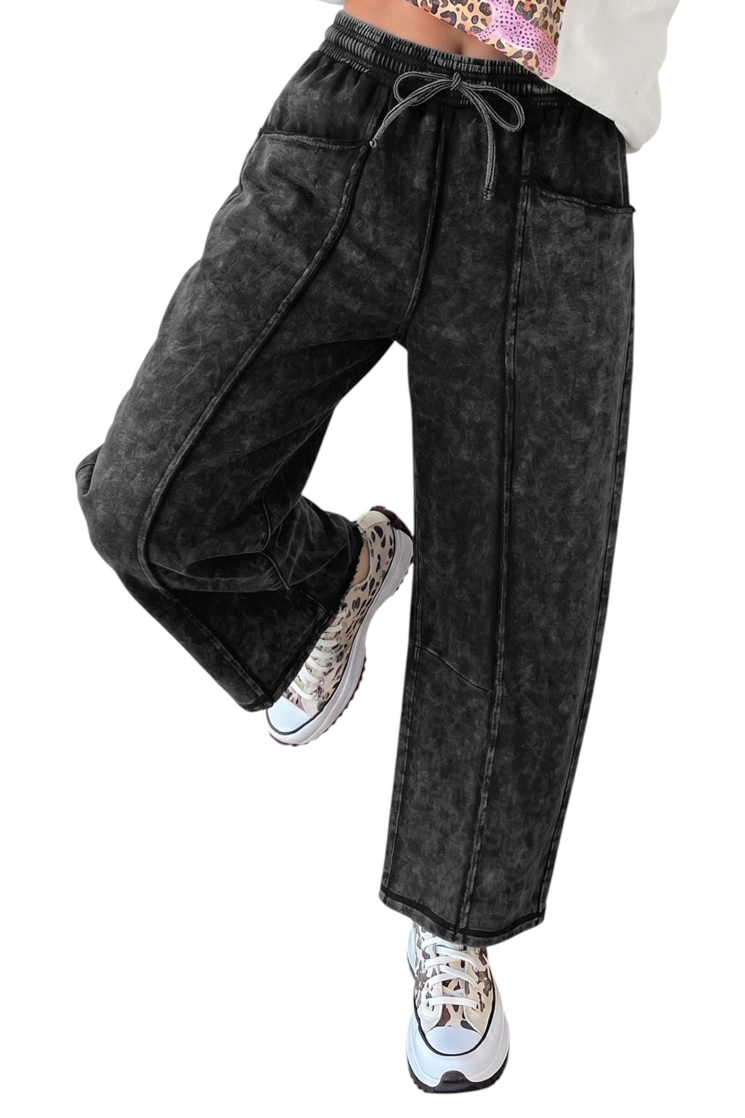 Doodlations Coffee Bar & Boutique black mineral wash barrel pants with raw seams, elastic waist, and drawstring.