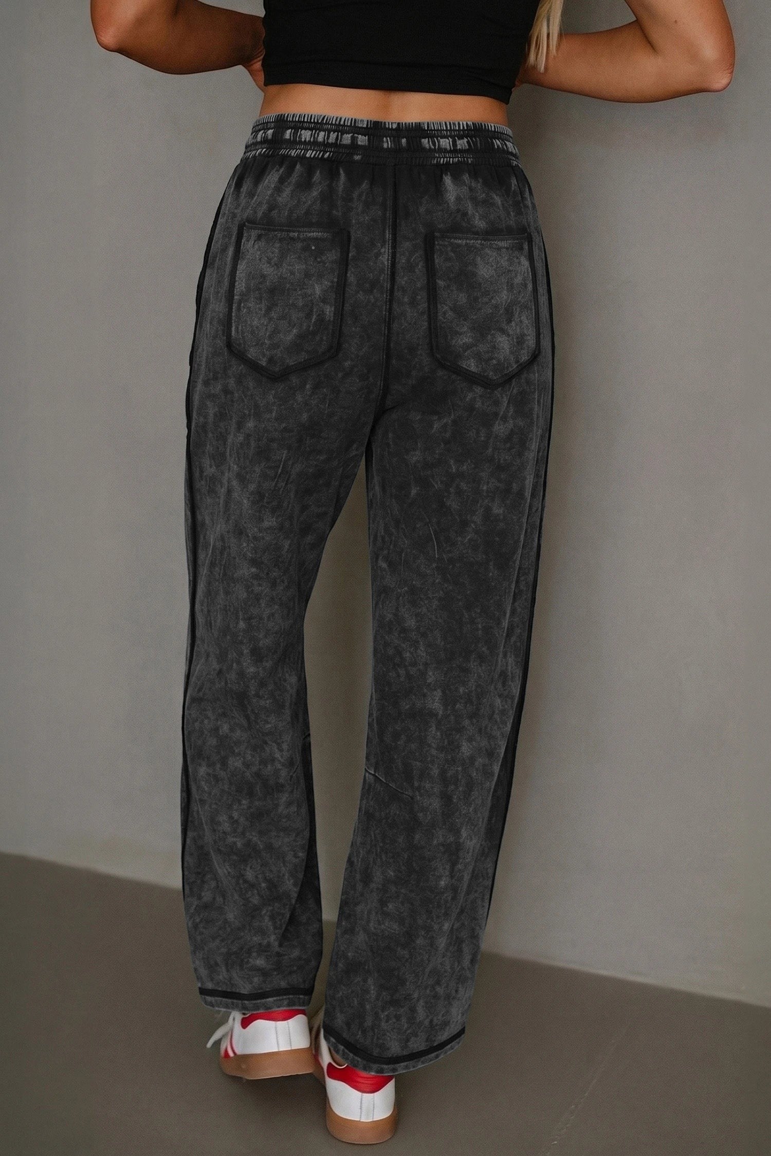 Doodlations Coffee Bar & Boutique black mineral wash barrel pants with elastic waist and raw seam back view
