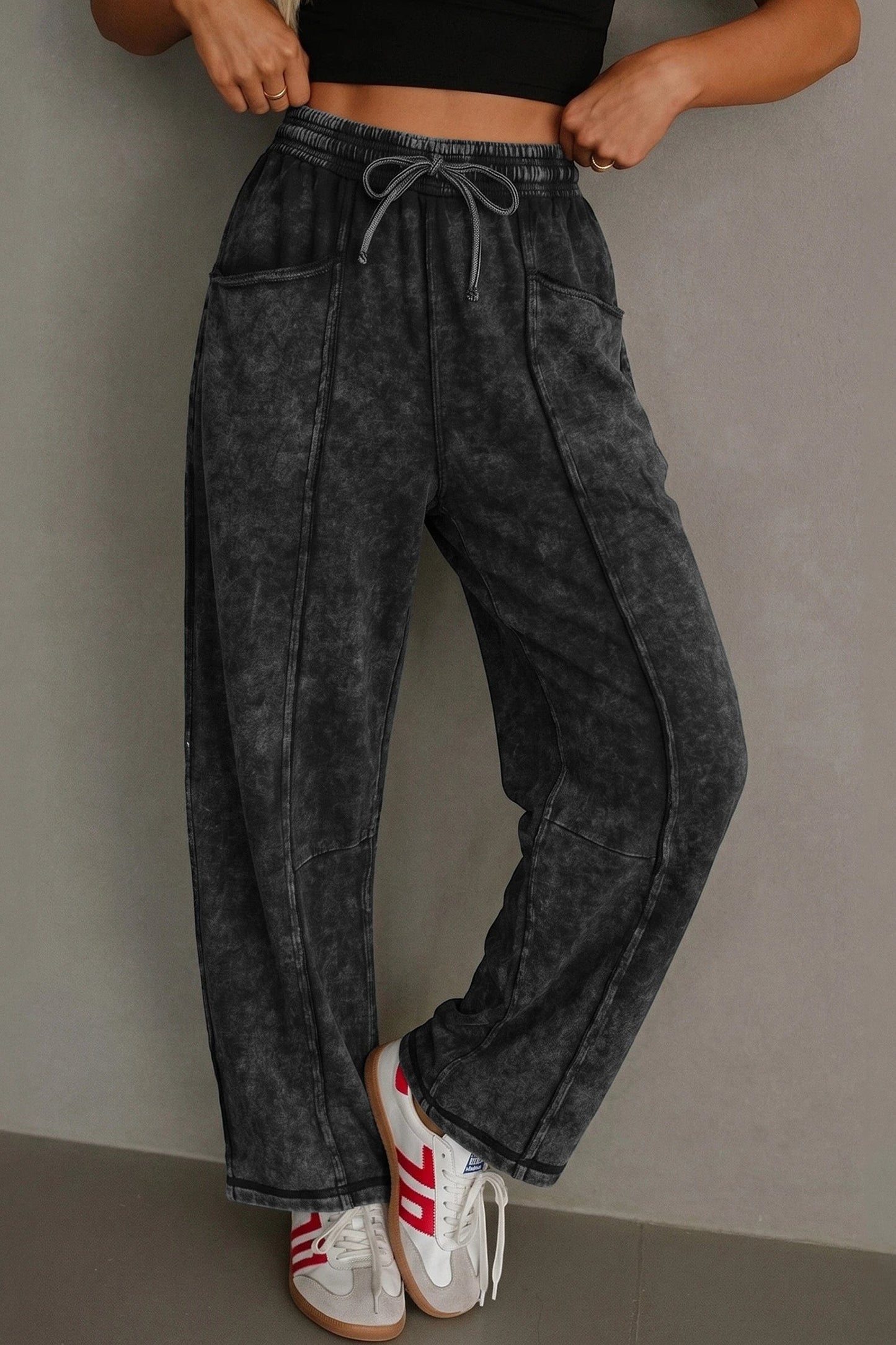 Doodlations Coffee Bar & Boutique black mineral wash barrel pants with raw seams, drawstring, and elastic waist.