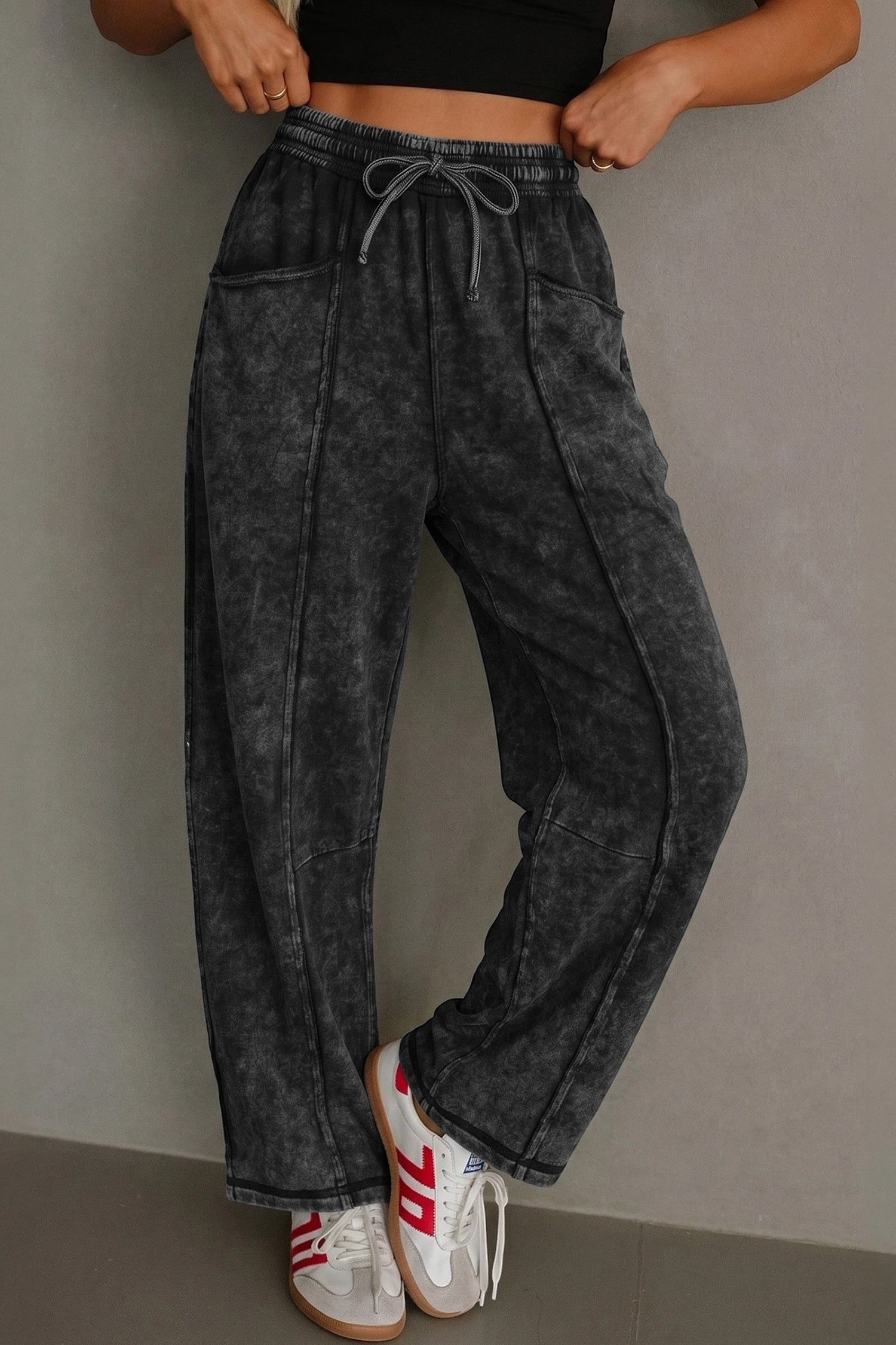Doodlations Coffee Bar & Boutique black mineral wash barrel pants with raw seams, drawstring, and elastic waist.