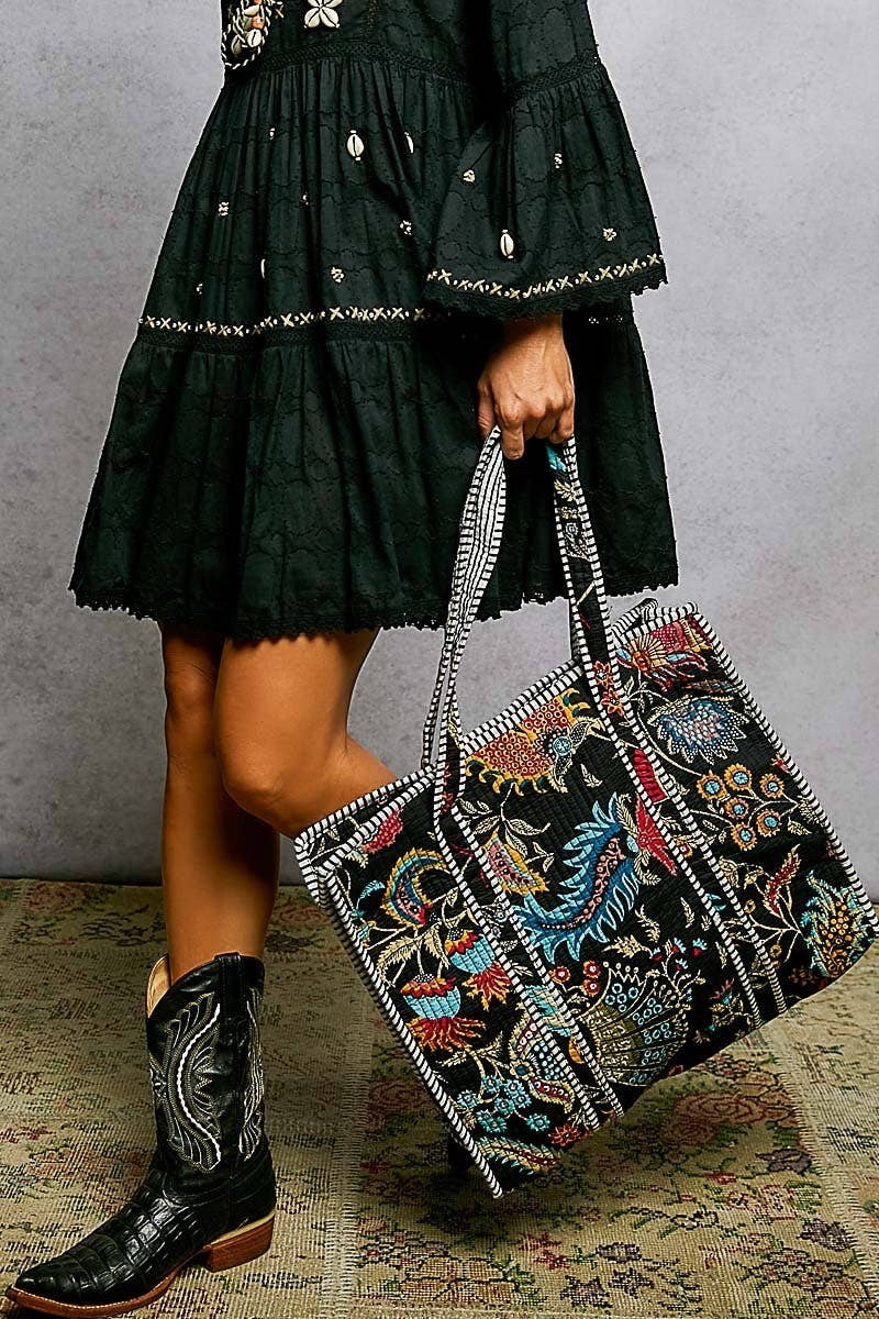 Doodlations Coffee Bar & Boutique black quilted tote bag with colorful floral print and striped binding accents