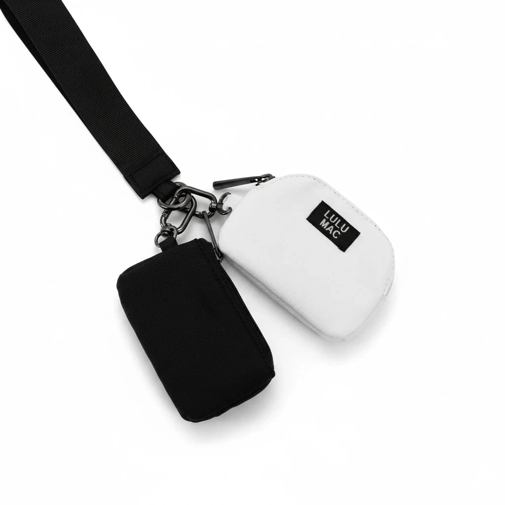 Doodlations Coffee Bar & Boutique Lulu Mac double pouch wristlet in black and white with a black wrist strap.