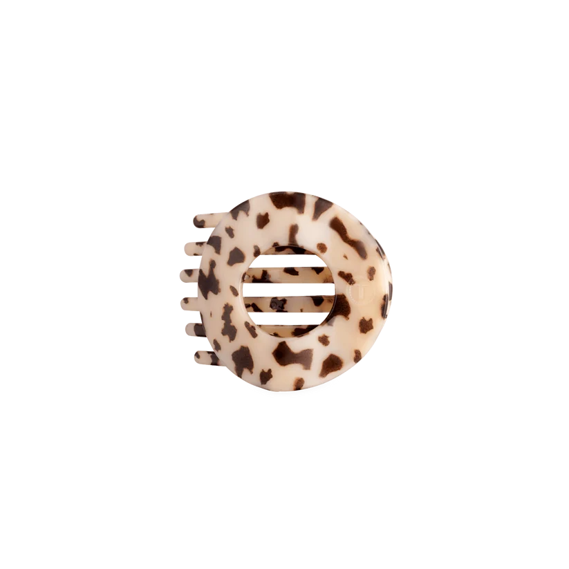 Doodlations Coffee Bar & Boutique blonde tortoise circular hair clip with a flat design for comfortable hold.