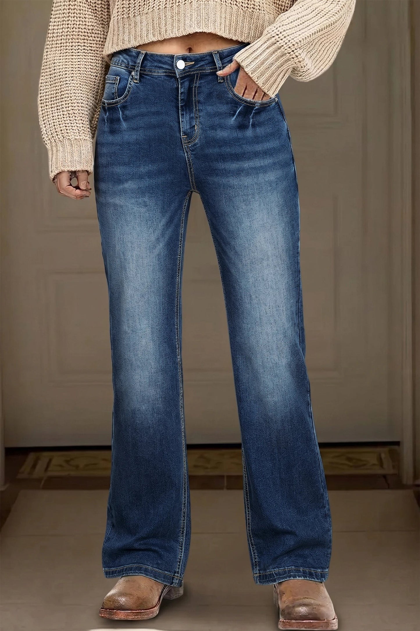 Doodlations Coffee Bar & Boutique blue acid washed straight leg denim jeans worn with a beige sweater and boots