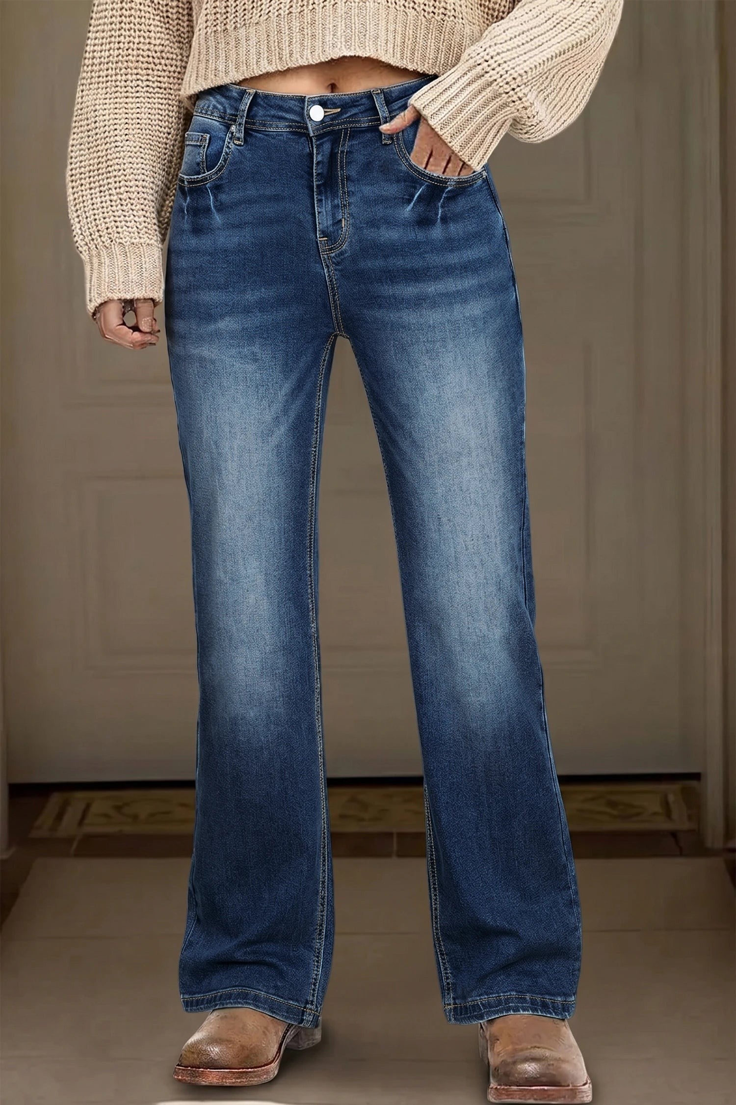 Doodlations Coffee Bar & Boutique blue acid washed straight leg denim jeans worn with a beige sweater and boots