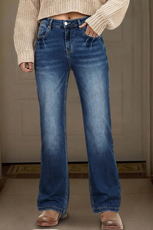 Doodlations Coffee Bar & Boutique blue acid washed straight leg denim jeans worn with a beige sweater and boots