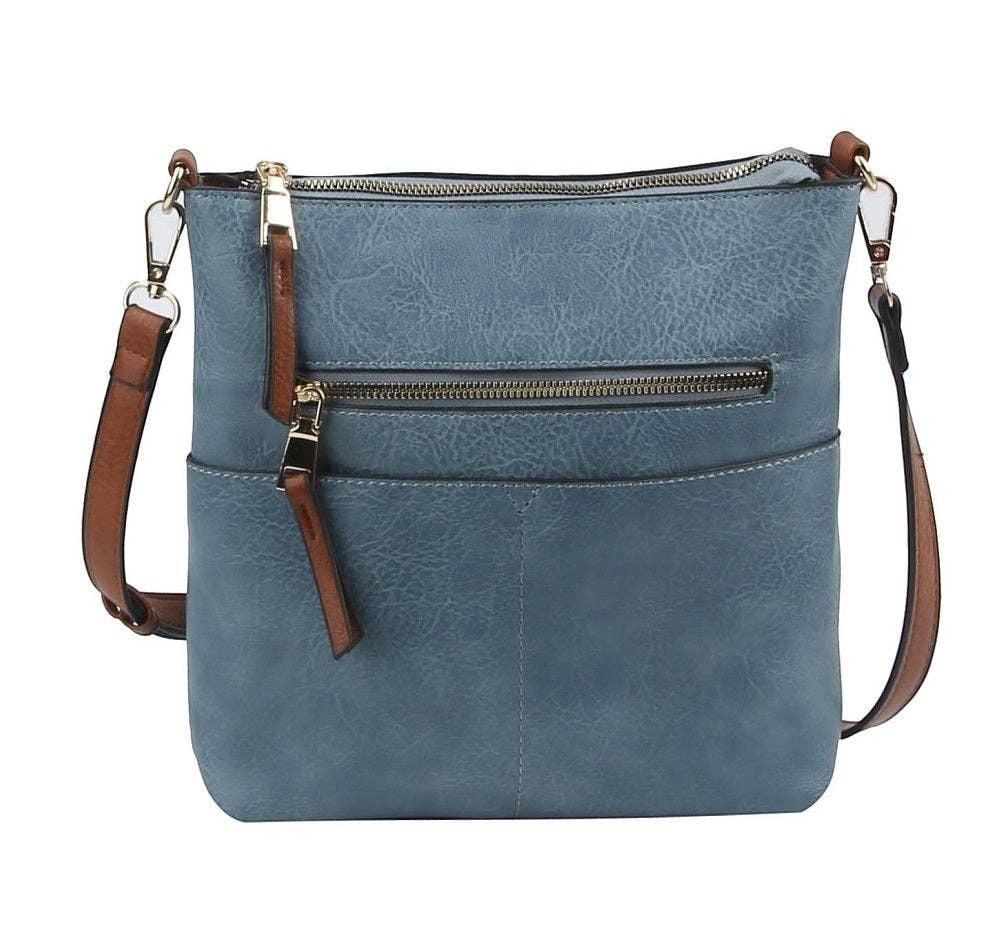 Doodlations Coffee Bar & Boutique blue vegan leather crossbody bag with gold-tone hardware and multiple pockets.