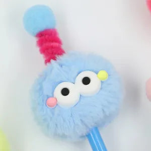 Doodlations Coffee Bar & Boutique blue fuzzy monster gel pen with expressive eyes and a pink antenna topper