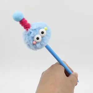 Doodlations Coffee Bar & Boutique blue fuzzy monster gel pen with a plush topper, googly eyes, and antenna.