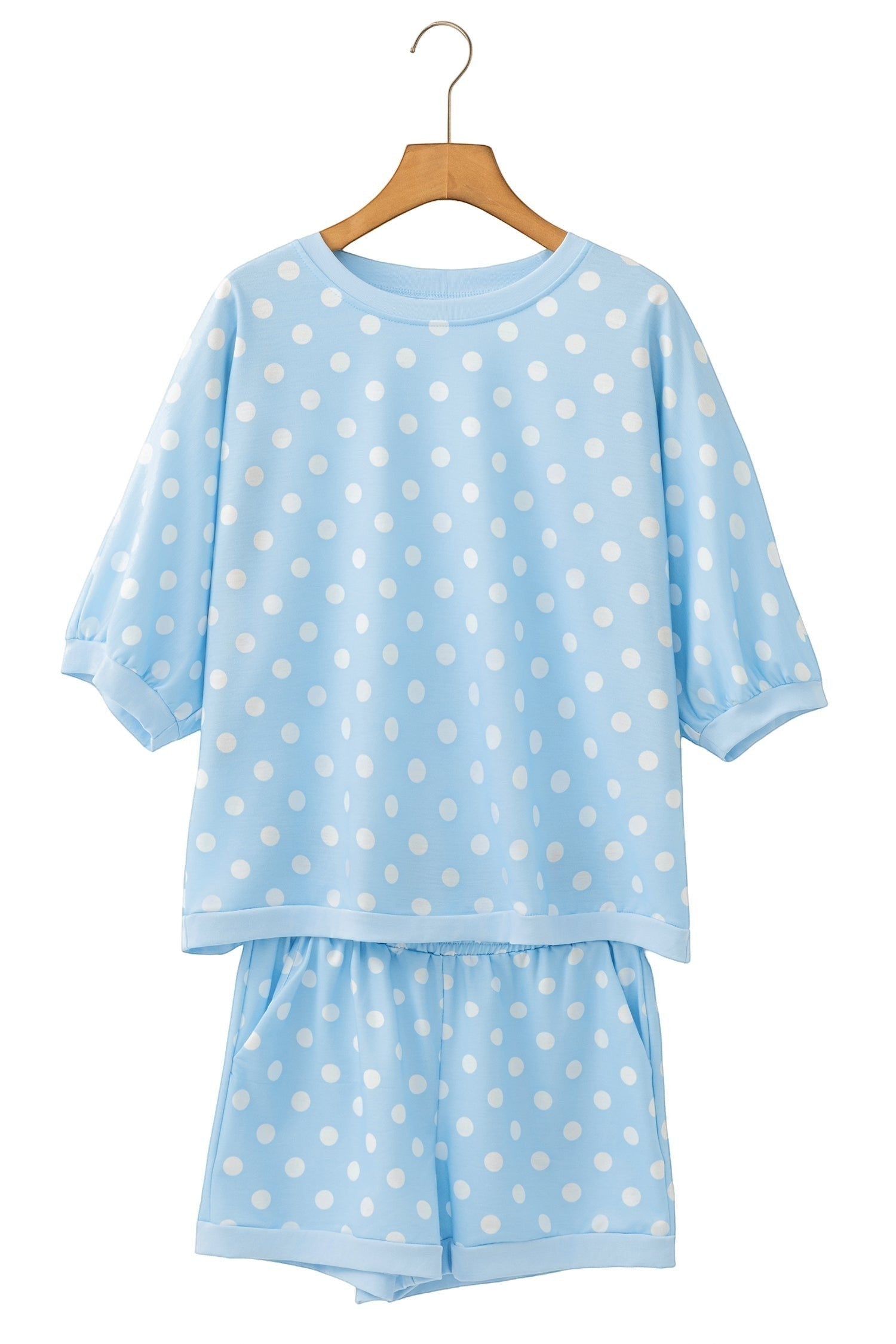 Doodlations Coffee Bar & Boutique light blue polka dot lounge set with short sleeves and matching shorts on a hanger