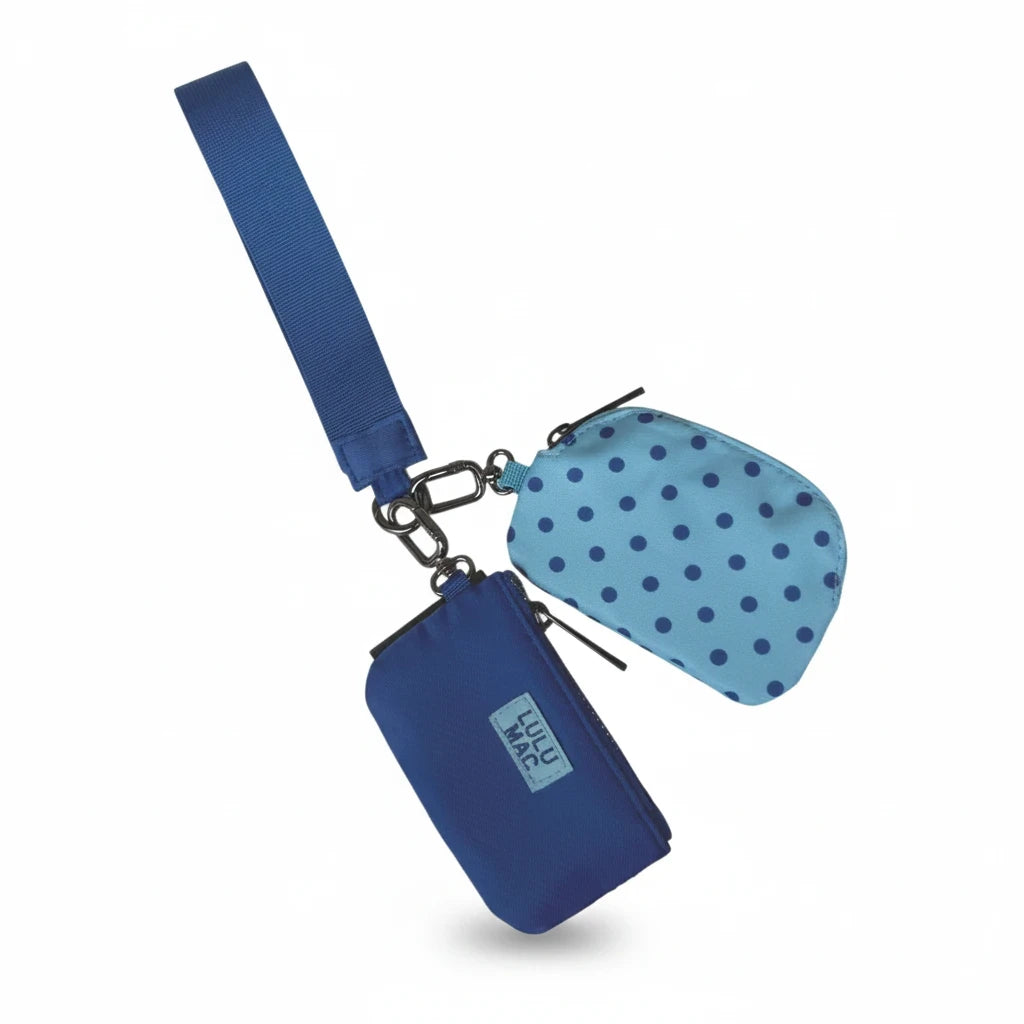 Doodlations Coffee Bar & Boutique Lulu Mac blue and navy polka dot double pouch wristlet with a matching strap.