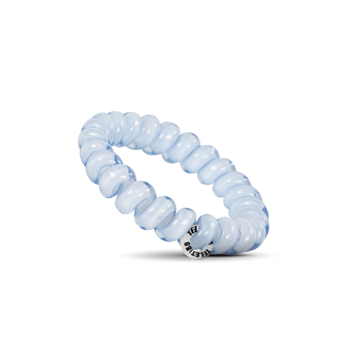Doodlations Coffee Bar & Boutique light blue spiral hair tie with a no-rip design on a black background