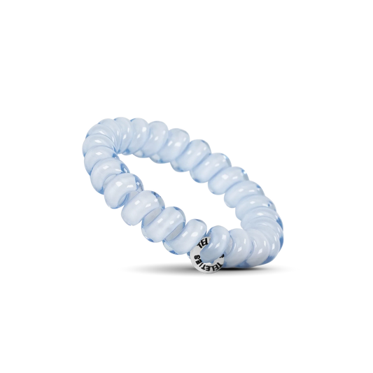 Doodlations Coffee Bar & Boutique light blue spiral hair tie with a no-rip design on a black background