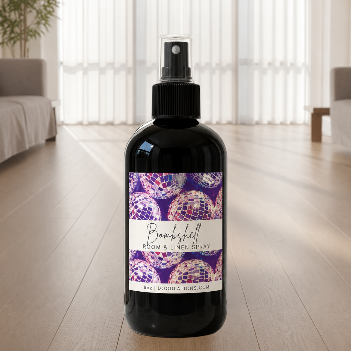 Doodlations Coffee Bar & Boutique Bombshell room and linen spray in a black bottle with disco ball label design