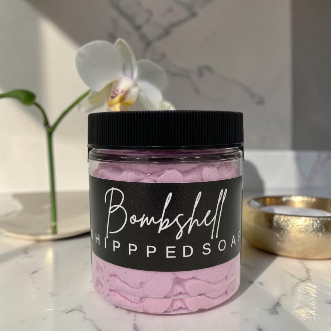 Doodlations Coffee Bar & Boutique Bombshell whipped soap in a clear jar with a black lid and label.
