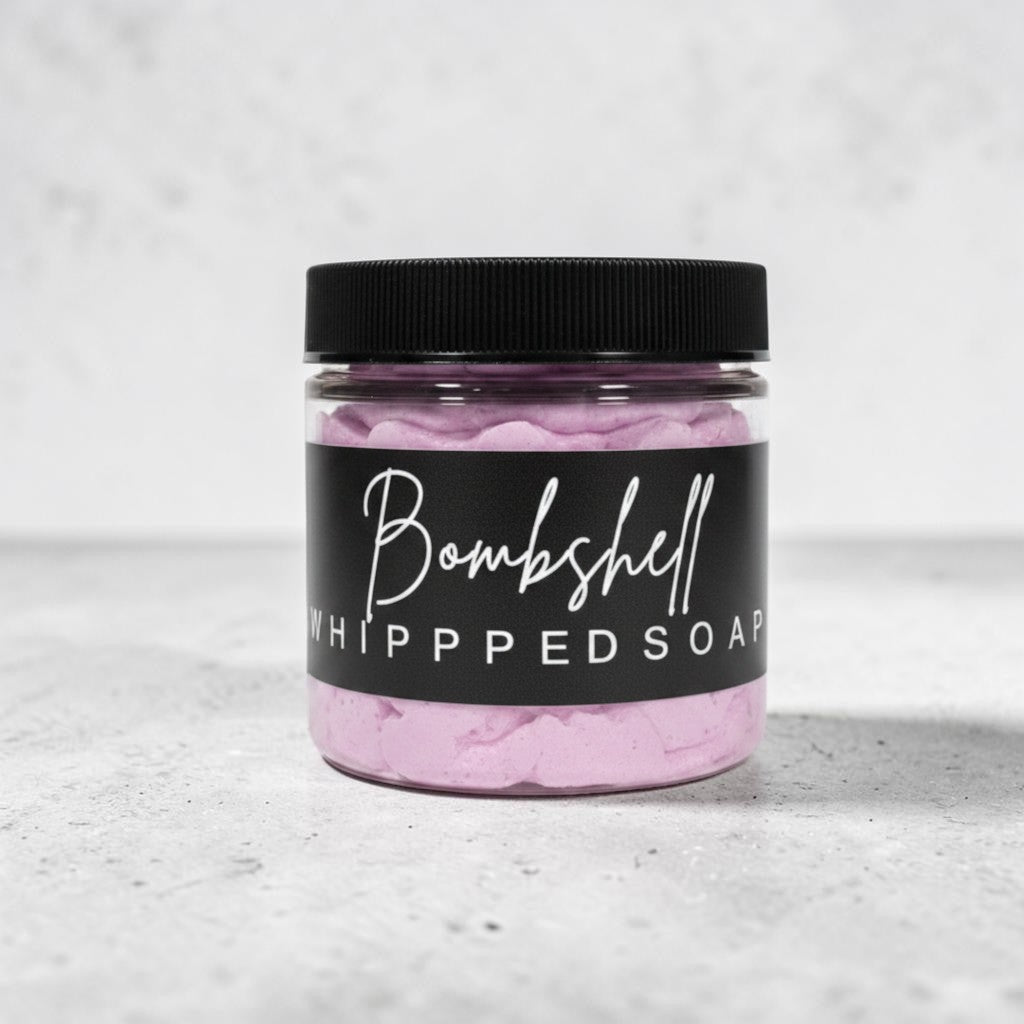 Doodlations Coffee Bar & Boutique Bombshell whipped soap in a clear jar with a black lid and label.
