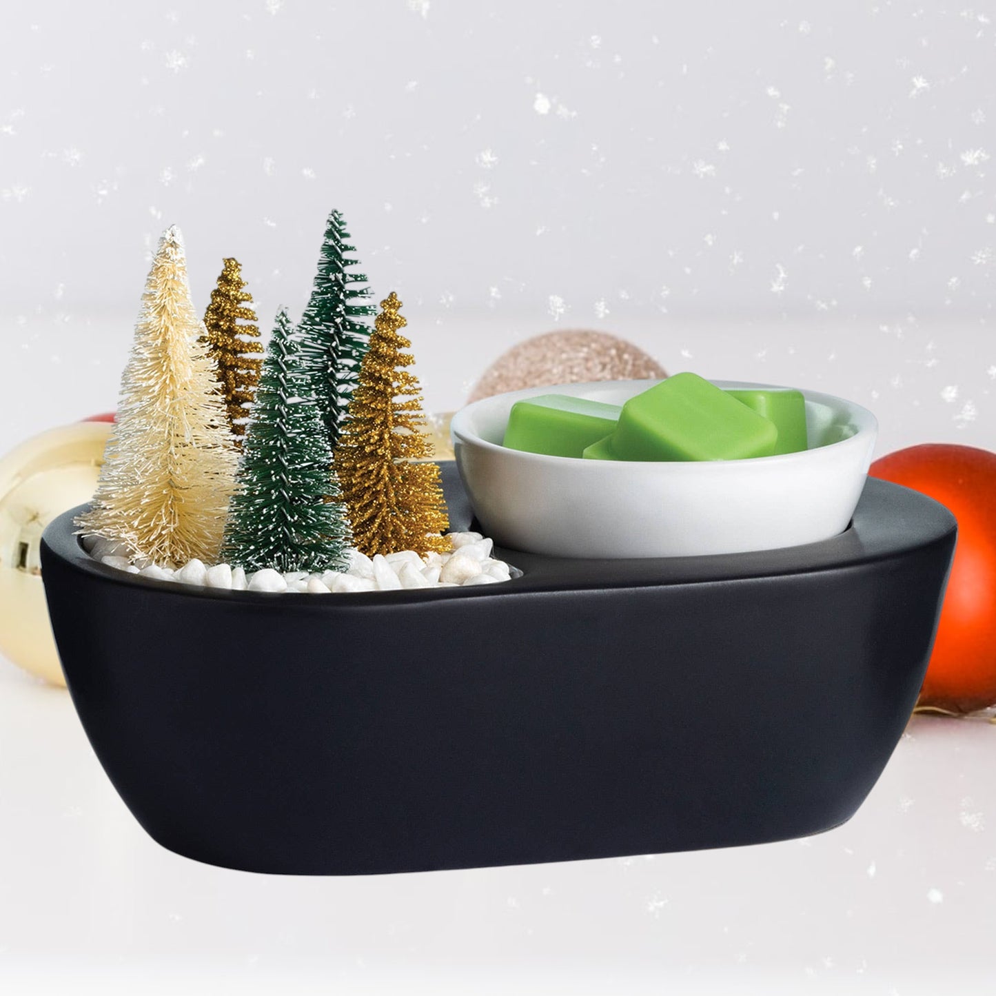 Doodlations Coffee Bar & Boutique black wax warmer with bottle brush trees and green wax melts.