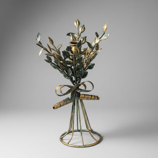 Doodlations Coffee Bar & Boutique brass leaf motif candleholder, 11 inches tall, with a vintage patina finish. Ideal for pillar candles.