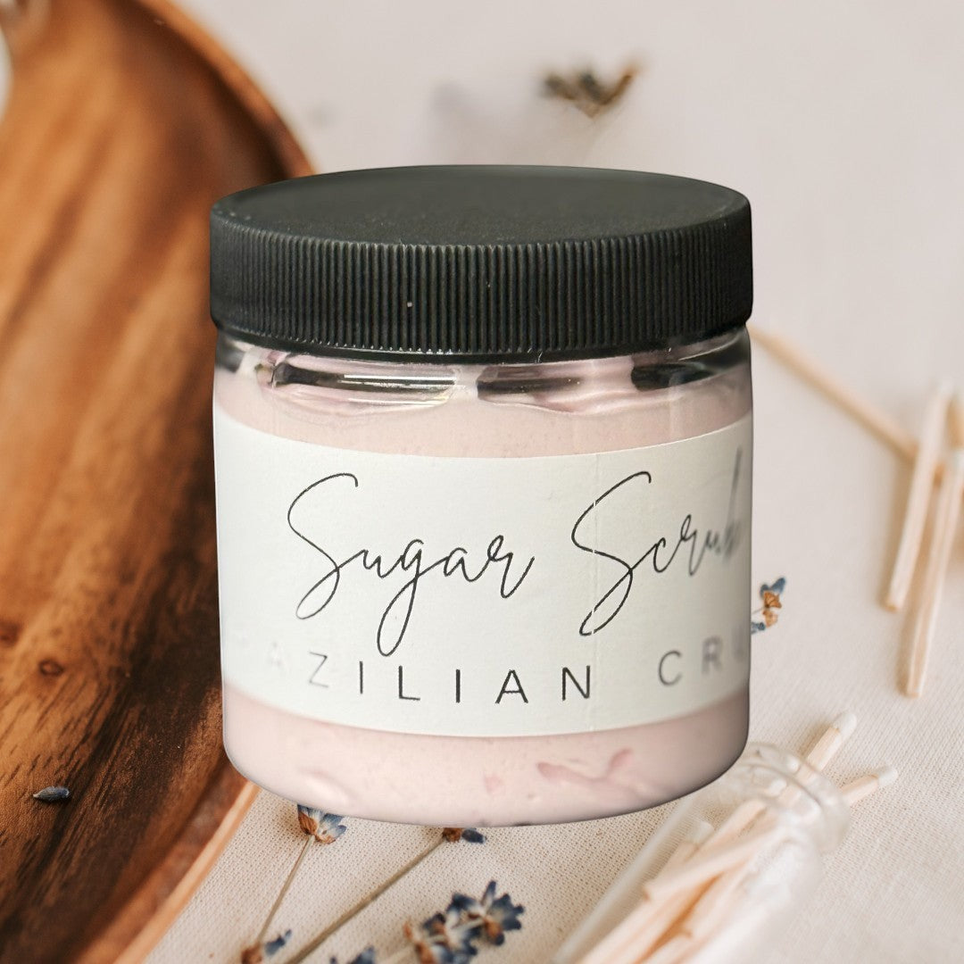 Doodlations Coffee Bar & Boutique Brazil Crush sugar scrub in a clear jar with a black lid. Pink scrub inside.