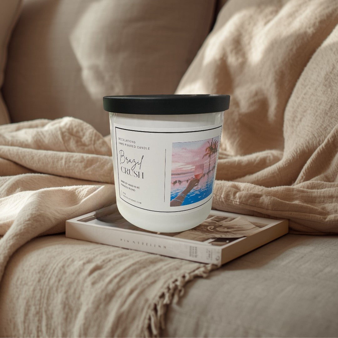 Doodlations Coffee Bar & Boutique Brazilian Crush hand-poured soy blend candle with tropical sunset beach scene.