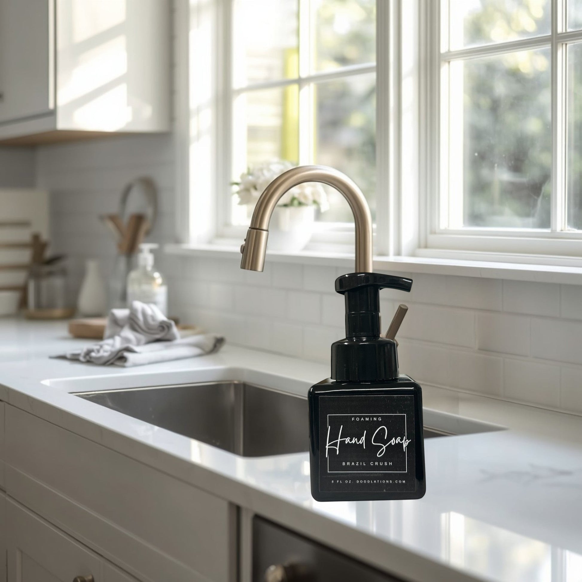 Doodlations Coffee Bar & Boutique Brazilian Crush foaming hand soap in a black pump bottle.