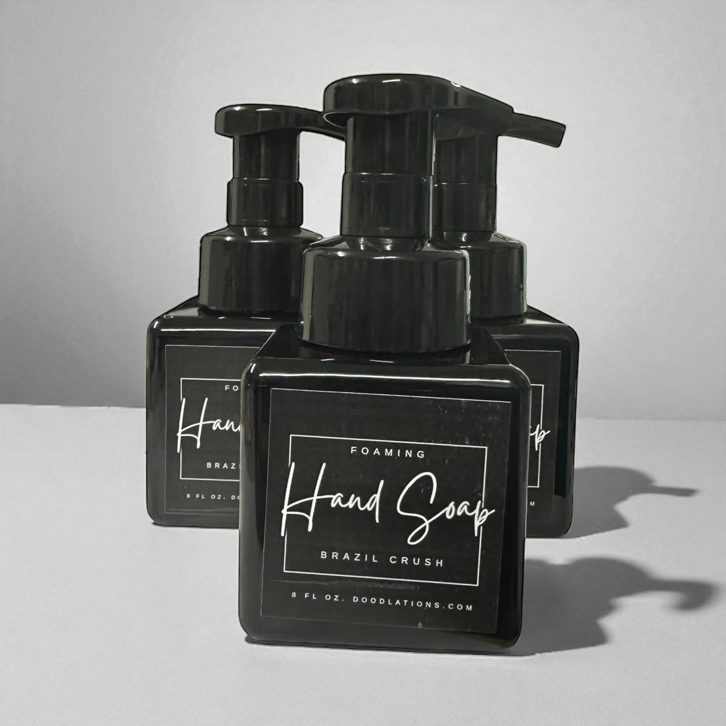 Doodlations Coffee Bar & Boutique Brazilian Crush foaming hand soap in black bottle with white label.