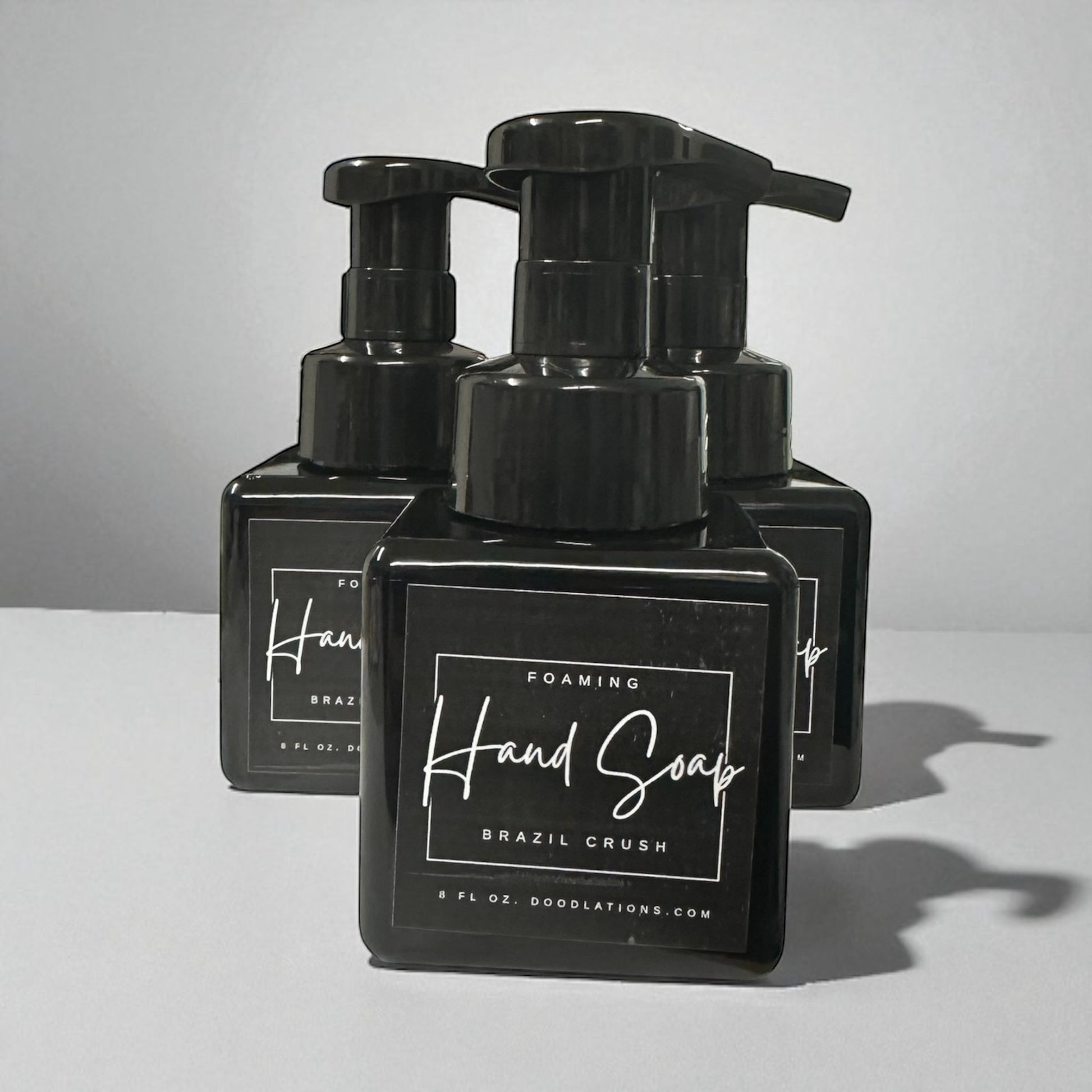 Doodlations Coffee Bar & Boutique Brazilian Crush foaming hand soap in black bottle with white label.