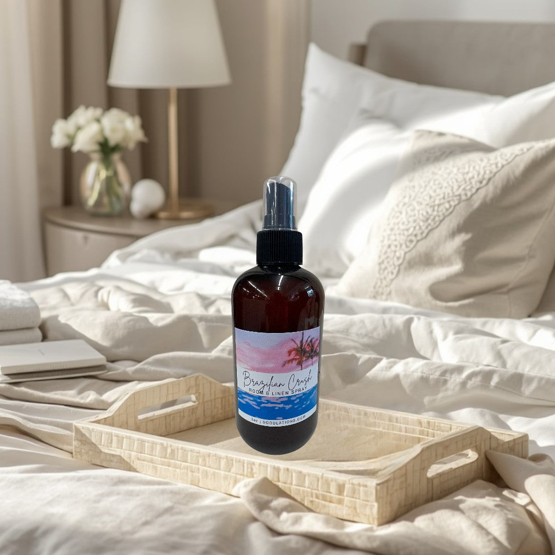 Doodlations Coffee Bar & Boutique Brazilian Crush room & linen spray in amber bottle with tropical sunset label.