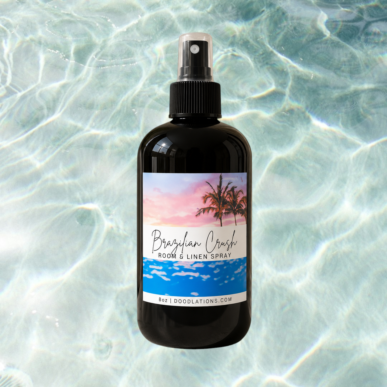 Doodlations Coffee Bar & Boutique Brazilian Crush room and linen spray in a black bottle with tropical sunset label.