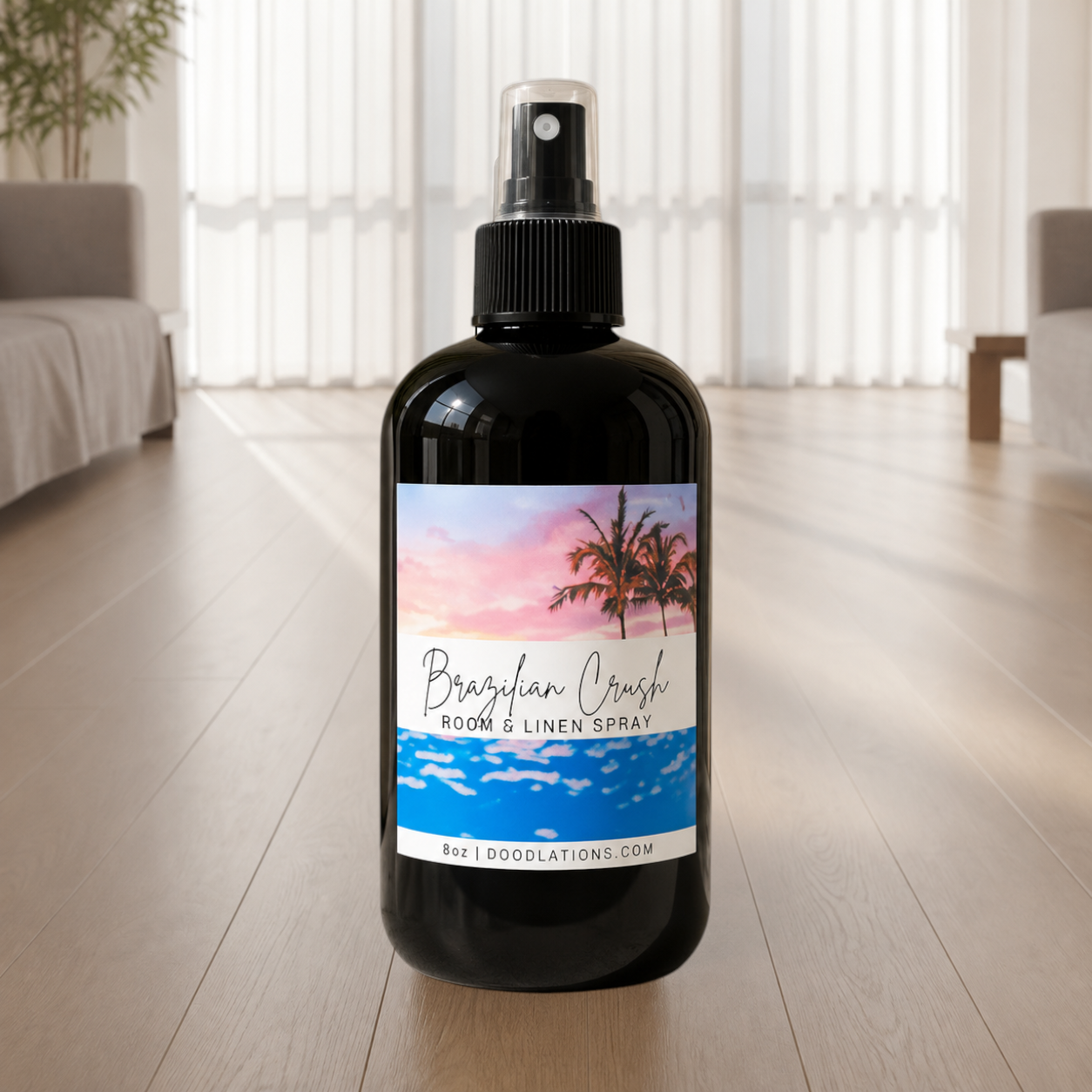 Doodlations Coffee Bar & Boutique Brazilian Crush room and linen spray in a black bottle with tropical label art.