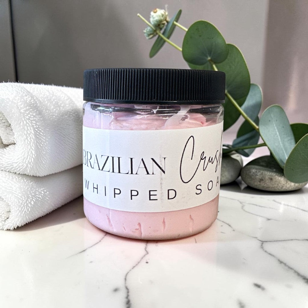 Doodlations Coffee Bar & Boutique 4oz jar of pink Brazilian Crush whipped soap with a black lid.