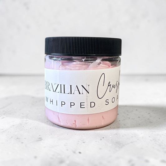 Doodlations Coffee Bar & Boutique Brazilian Crush whipped soap in a 4 oz jar with a black lid and light pink cream.
