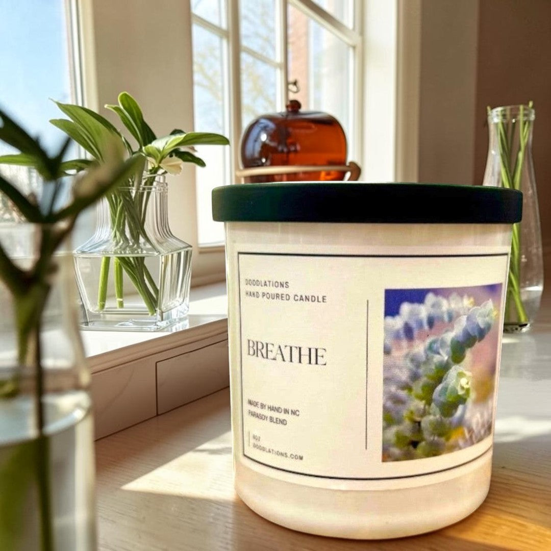 Doodlations Coffee Bar & Boutique Breathe luxury hand-poured soy blend candle with a calming scent profile.