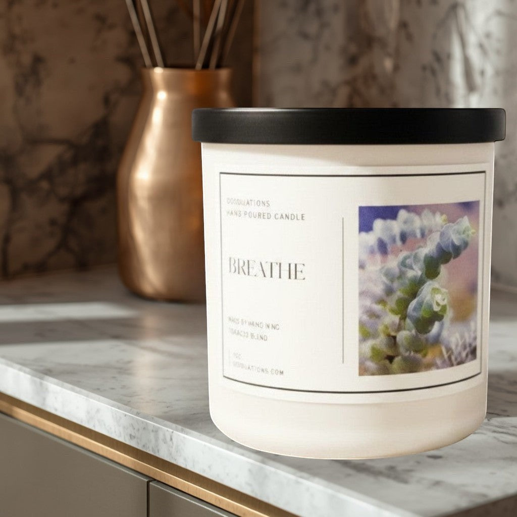 Doodlations Coffee Bar & Boutique Breathe luxury hand-poured candle with a calming scent profile and a botanical image.