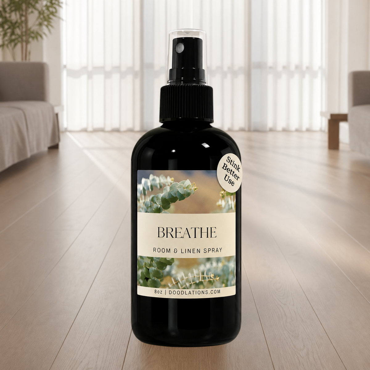 Doodlations Coffee Bar & Boutique Breathe room and linen spray in a black glass bottle with eucalyptus label design.
