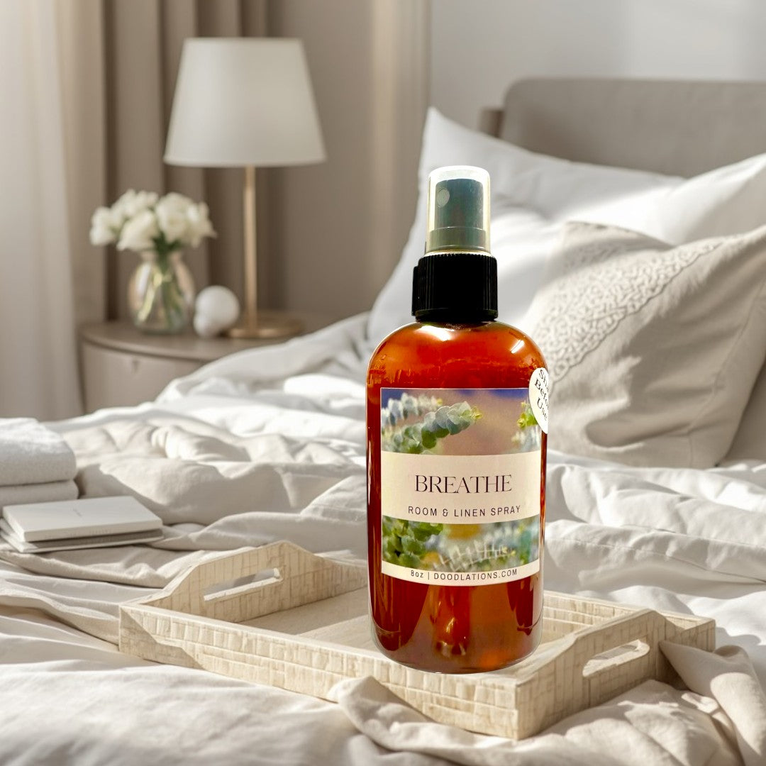 Doodlations Coffee Bar & Boutique Breathe room and linen spray in amber bottle with eucalyptus label. Calming fragrance.
