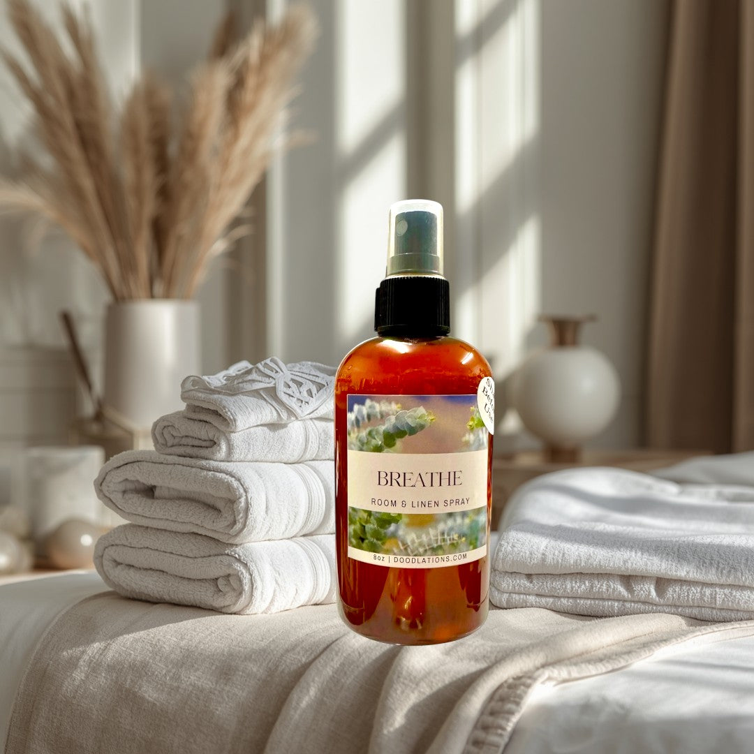 Doodlations Coffee Bar & Boutique Breathe room and linen spray in amber bottle with eucalyptus label. Calming fragrance.