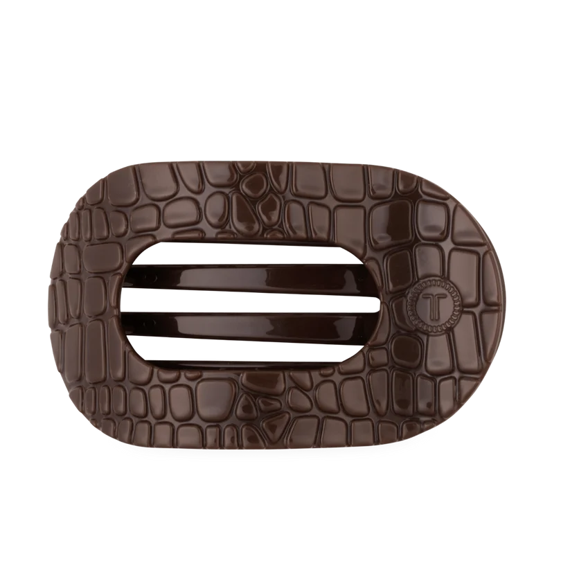 Doodlations Coffee Bar & Boutique brown crocodile-textured flat round hair clip with bendable teeth for secure hold.
