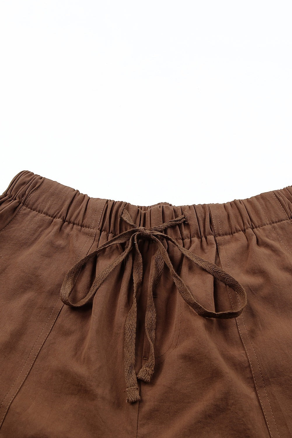 Doodlations Coffee Bar & Boutique brown cotton drawstring shorts with pockets and elastic waist.