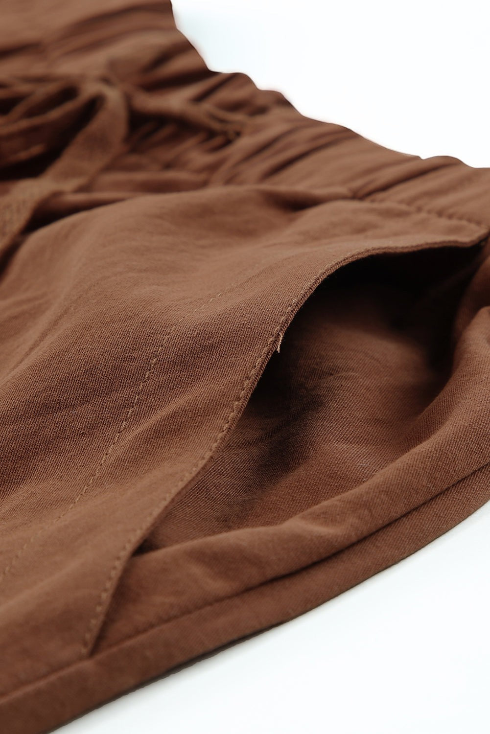 Doodlations Coffee Bar & Boutique brown cotton drawstring shorts with side pockets and relaxed fit.