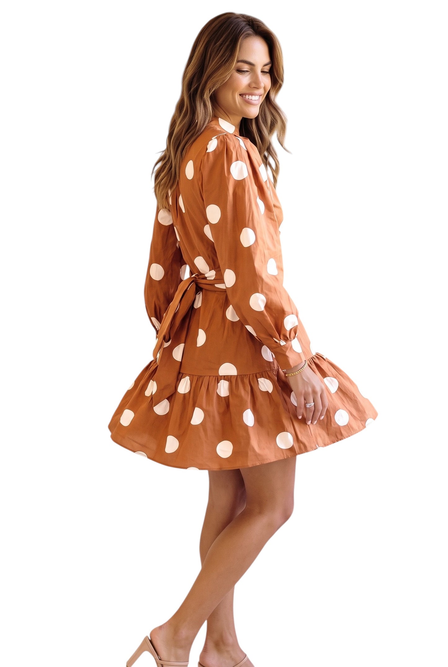 Doodlations Coffee Bar & Boutique brown polka dot long sleeve mini dress with tie waist on a smiling woman