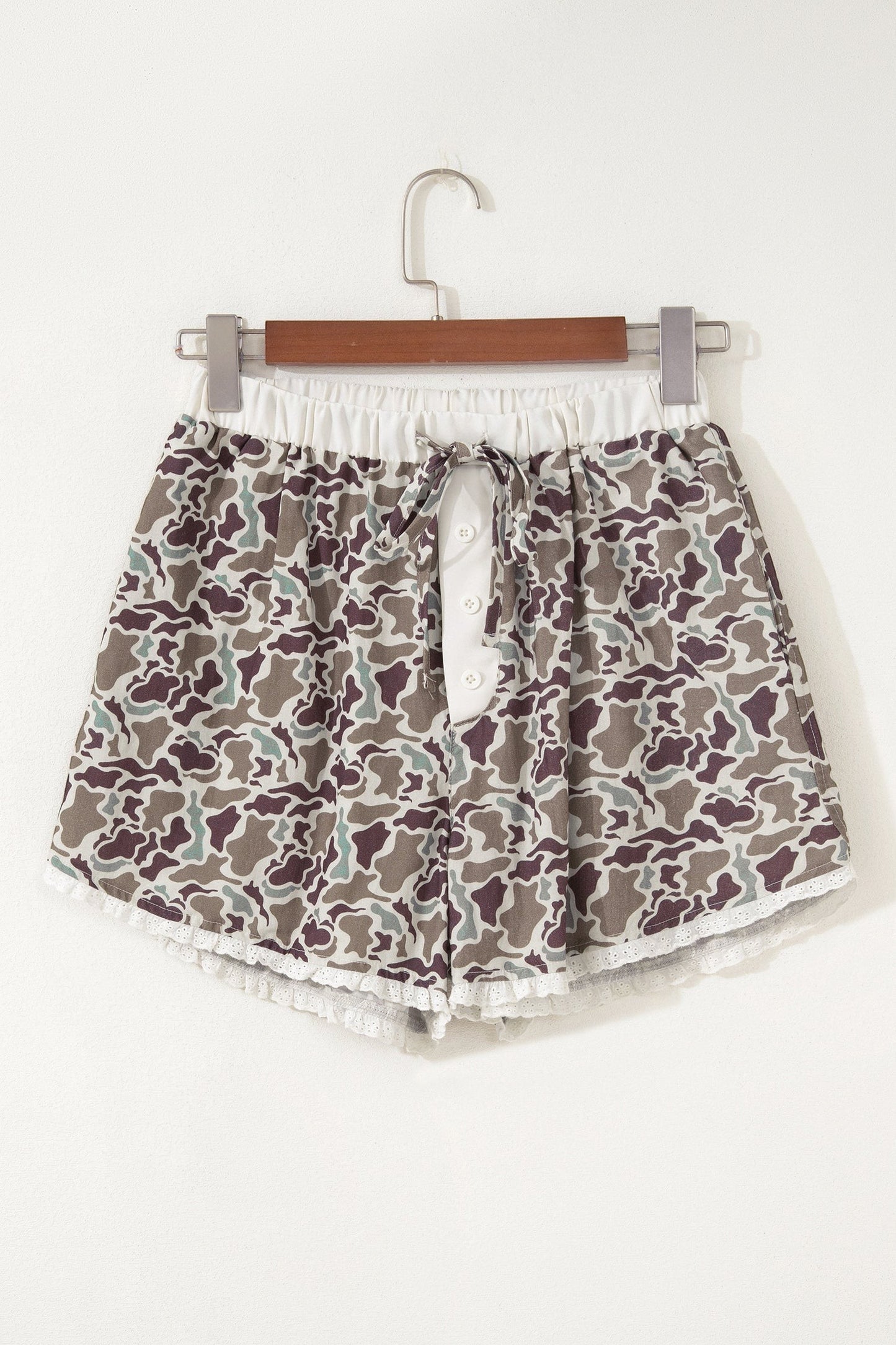 Doodlations Coffee Bar & Boutique camo print lounge shorts with button front, drawstring waist, and white lace trim.