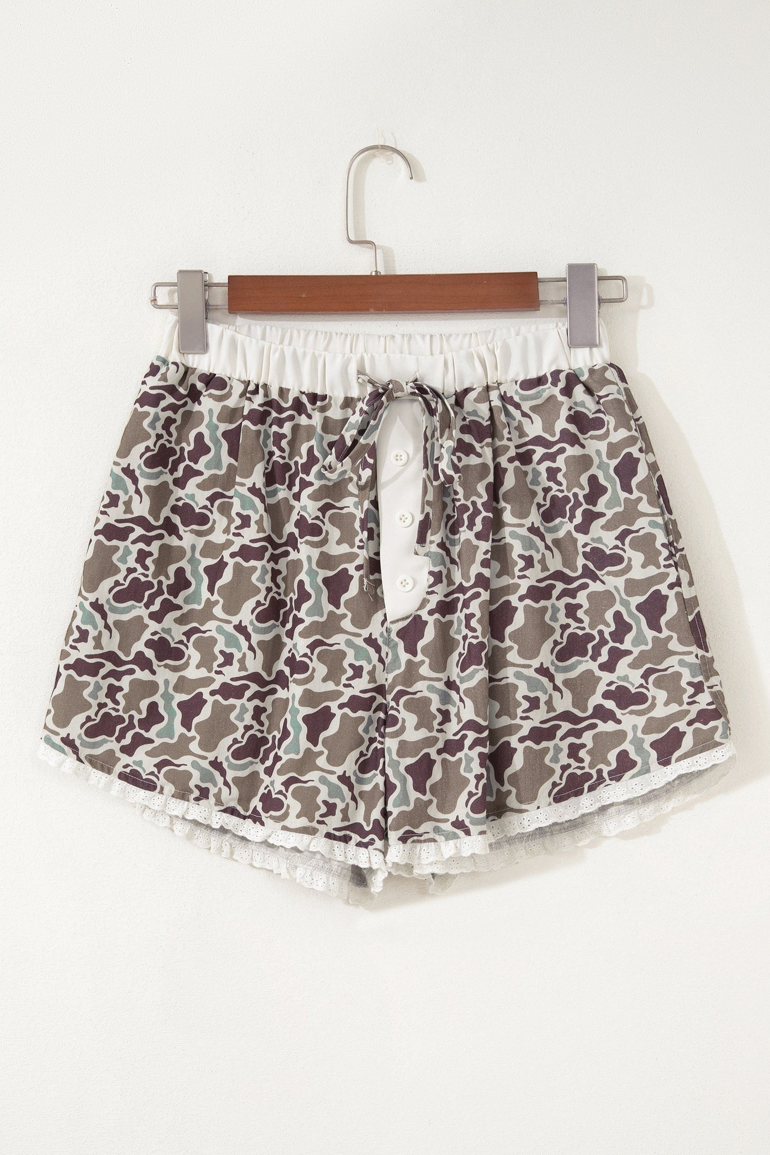 Doodlations Coffee Bar & Boutique camo print lounge shorts with button front, drawstring waist, and white lace trim.